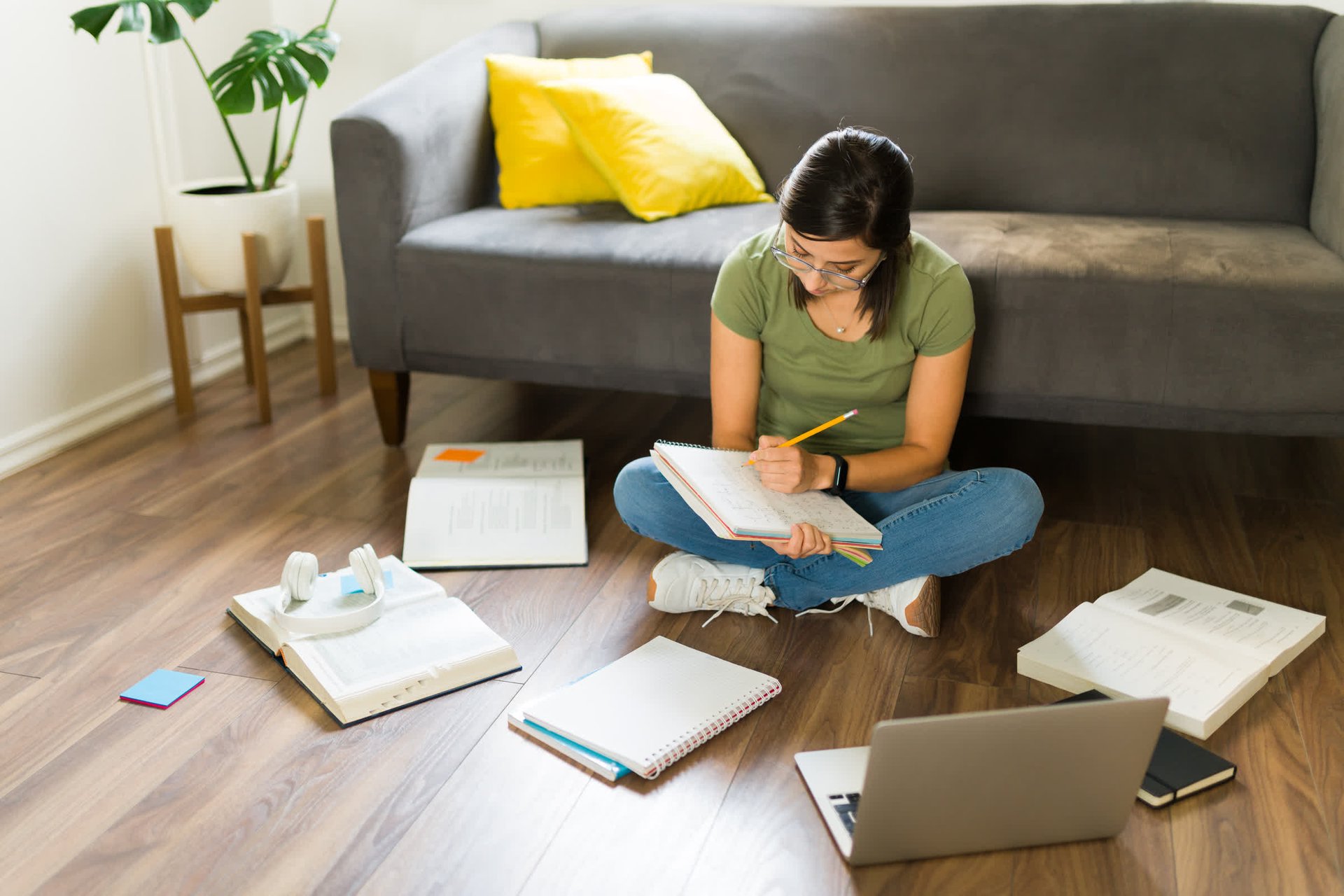resized_mid-adult-woman-doing-her-college-homework-home-studying-with-books-university-exams