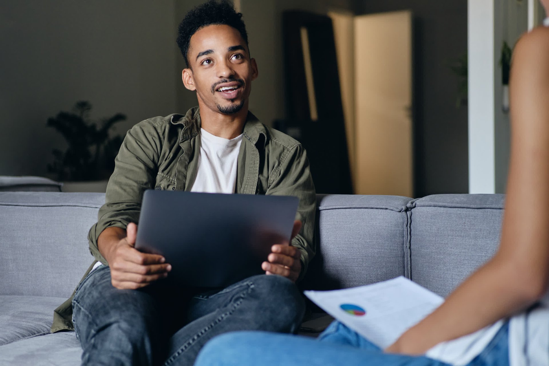 resized_young-excited-casual-african-american-man-with-laptop-happily-working-with-colleague-modern-co-working-space